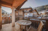 Enjoy breathtaking mountain views from this charming balcony.