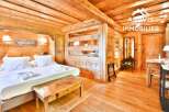 Experience rustic charm in this stunning property, featuring exquisite wooden interiors and a cozy ambiance.
