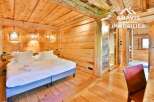 Experience the rustic charm of this stunning property, featuring exquisite wooden interiors and a cozy ambiance.