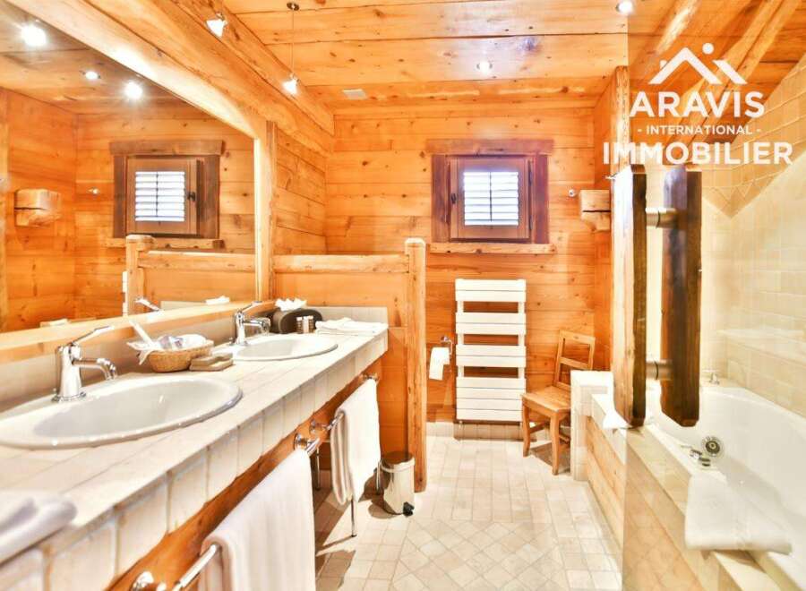 Experience the warmth of this stunning bathroom featuring natural wood finishes throughout.