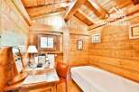Discover the charm of this cozy wooden cabin, perfect for a relaxing getaway.