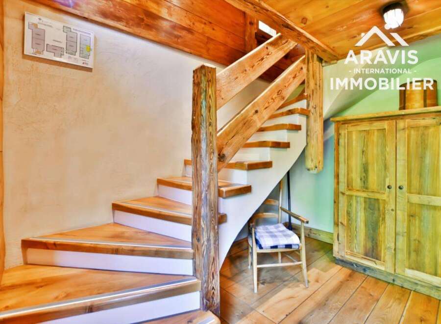 Discover the charm of this property, featuring a beautifully crafted wooden staircase that adds a touch of rustic elegance.