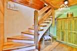 Discover the charm of this property, featuring a beautifully crafted wooden staircase that adds a touch of rustic elegance.