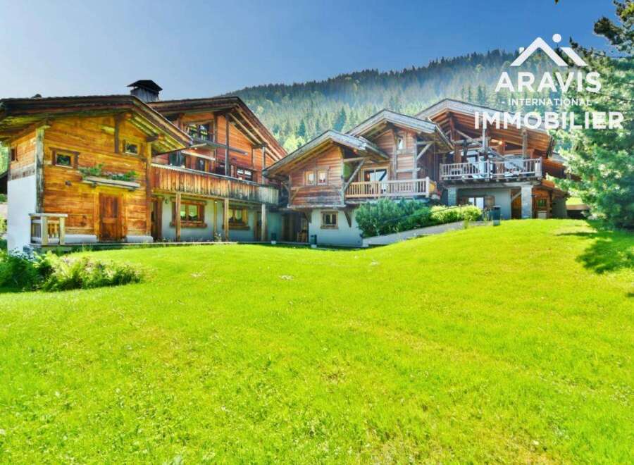 Discover a stunning chalet nestled in a picturesque mountain setting.