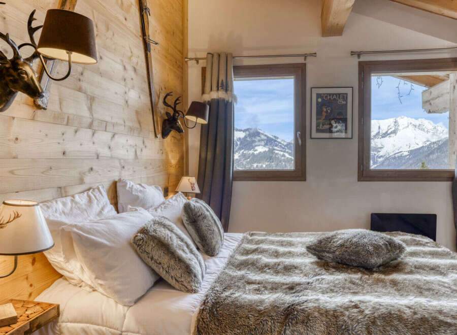 Experience the ultimate mountain retreat in this cozy bedroom.