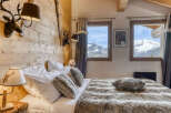 Experience the ultimate mountain retreat in this cozy bedroom.