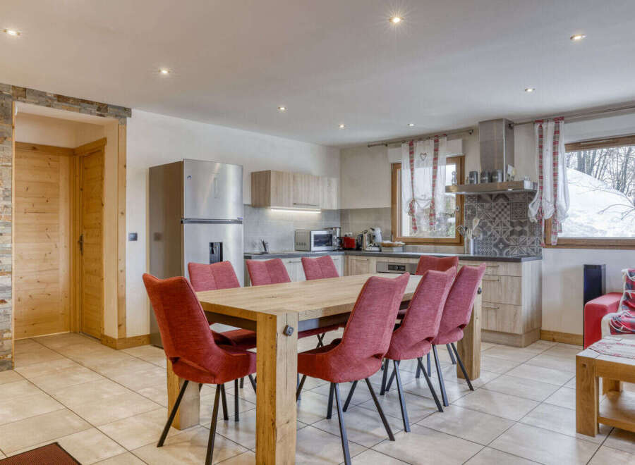 This charming property boasts a spacious open-plan kitchen and dining area, perfect for entertaining.