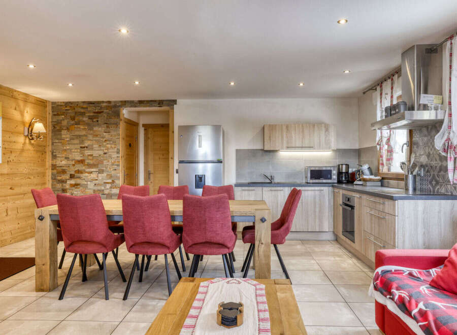 This charming property features a spacious open-plan living and dining area, perfect for entertaining.