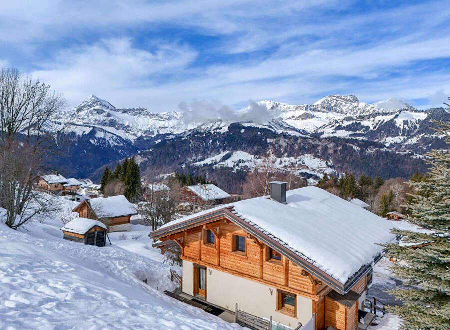 Discover the charm of this stunning mountain chalet nestled in a picturesque winter wonderland.