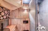 Discover the charm of this unique property, featuring a beautifully designed bathroom with a modern shower and stylish wooden accents.