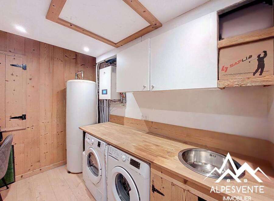 Discover the charm of this well-appointed laundry room, featuring modern appliances and ample storage.