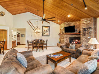 This stunning living room boasts a cozy fireplace, perfect for chilly evenings.