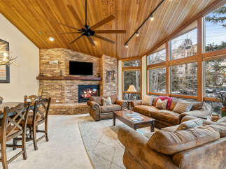 Experience luxury living in this stunning property featuring a cozy fireplace, perfect for chilly evenings.