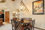 This charming dining area features a rustic wooden table and chairs, perfect for family gatherings.