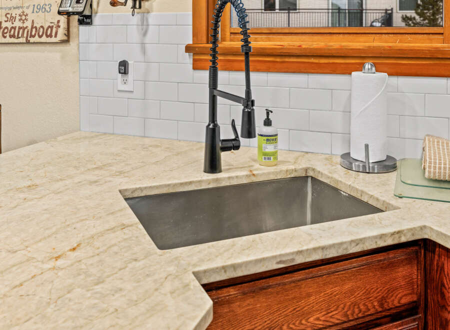 This stunning kitchen boasts a modern farmhouse design, perfect for culinary enthusiasts.