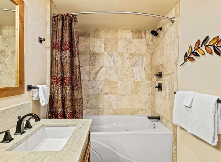 Step into a luxurious bathroom featuring a modern design and elegant finishes.