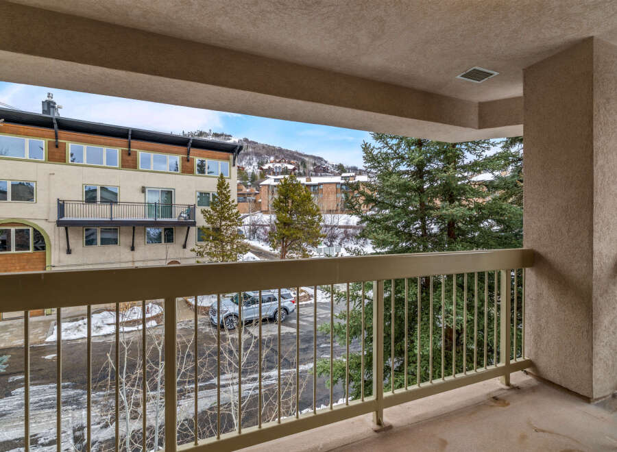 Enjoy stunning views from this beautiful balcony overlooking a serene winter landscape.