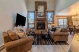 Experience luxury living in this stunning property featuring a cozy fireplace and a spacious living area.