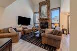 Experience luxury living in this stunning property featuring a cozy fireplace and a spacious living area.