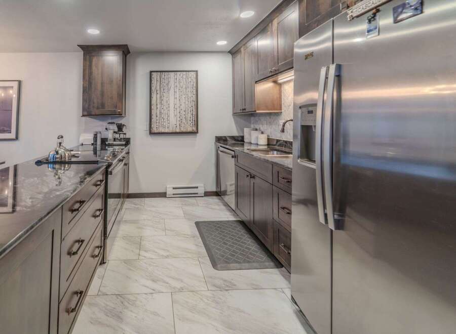 This stunning kitchen boasts modern design and high-end appliances, perfect for culinary enthusiasts.