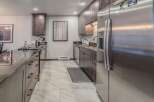 This stunning kitchen boasts modern design and high-end appliances, perfect for culinary enthusiasts.