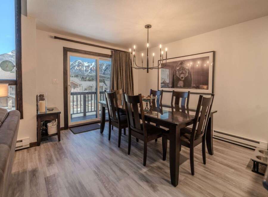 This stunning dining room boasts a modern aesthetic with a touch of rustic charm.