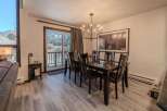 This stunning dining room boasts a modern aesthetic with a touch of rustic charm.