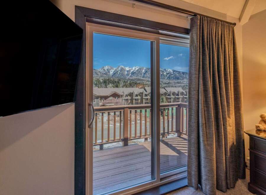 Enjoy breathtaking mountain views from this stunning property! This home features a spacious deck, perfect for relaxing and taking in the scenery.