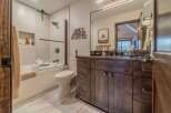 Step into this beautifully designed bathroom, featuring a modern aesthetic with a touch of rustic charm.