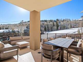 Enjoy breathtaking mountain views from this luxurious outdoor patio.