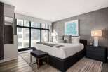 Experience luxury in this stunning bedroom featuring a modern design and high-end finishes.