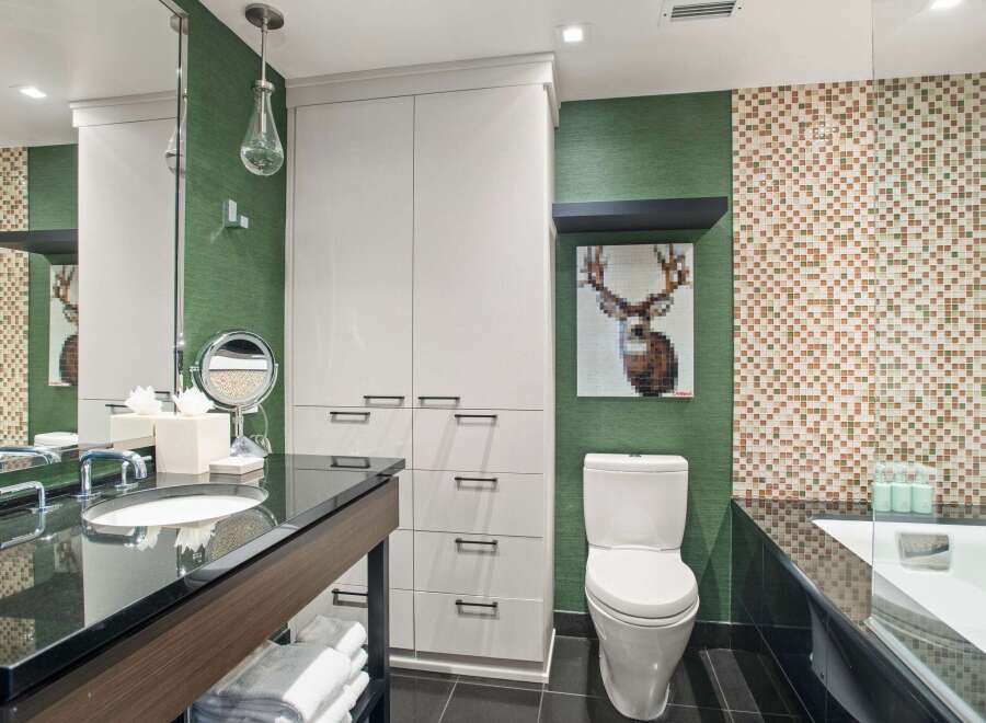 This modern bathroom boasts a sleek design with a combination of functionality and style.