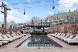 Enjoy a luxurious outdoor experience at this stunning property, featuring a heated pool and a stylish bar area.
