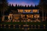Experience luxury living in this stunning modern home, featuring expansive glass walls that seamlessly blend indoor and outdoor spaces.