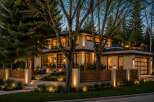 Experience luxury living in this stunning modern home featuring a rooftop deck with a hot tub and fire pit, perfect for entertaining.