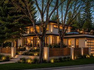 Experience luxury living in this stunning modern home featuring a rooftop deck with a hot tub and fire pit, perfect for entertaining.