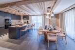 Experience luxury living in this stunning property, featuring a modern kitchen with sleek cabinetry and a spacious island perfect for entertaining.