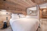 Experience rustic elegance in this stunning bedroom.