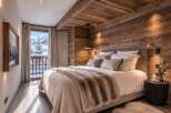 Experience ultimate comfort in this luxurious mountain retreat bedroom, featuring a plush king-sized bed adorned with a cozy fur throw.