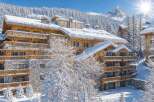 Experience luxury mountain living in this stunning chalet, nestled amidst snow-covered pines with breathtaking alpine views.