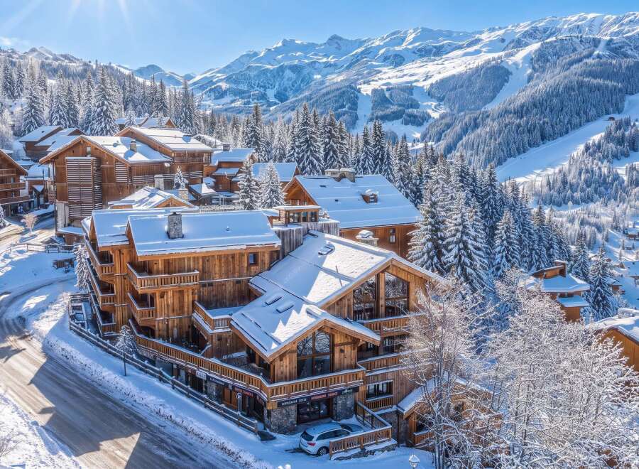 Experience luxury mountain living in this stunning chalet-style property nestled amidst snow-covered pine trees and majestic alpine peaks.