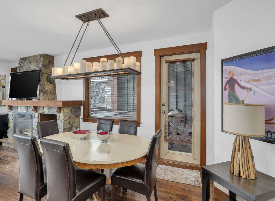 This stunning dining room features a cozy fireplace, perfect for those chilly evenings.