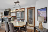 This stunning dining room features a cozy fireplace, perfect for those chilly evenings.
