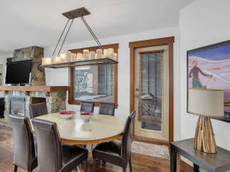 This stunning dining room features a cozy fireplace, perfect for those chilly evenings.