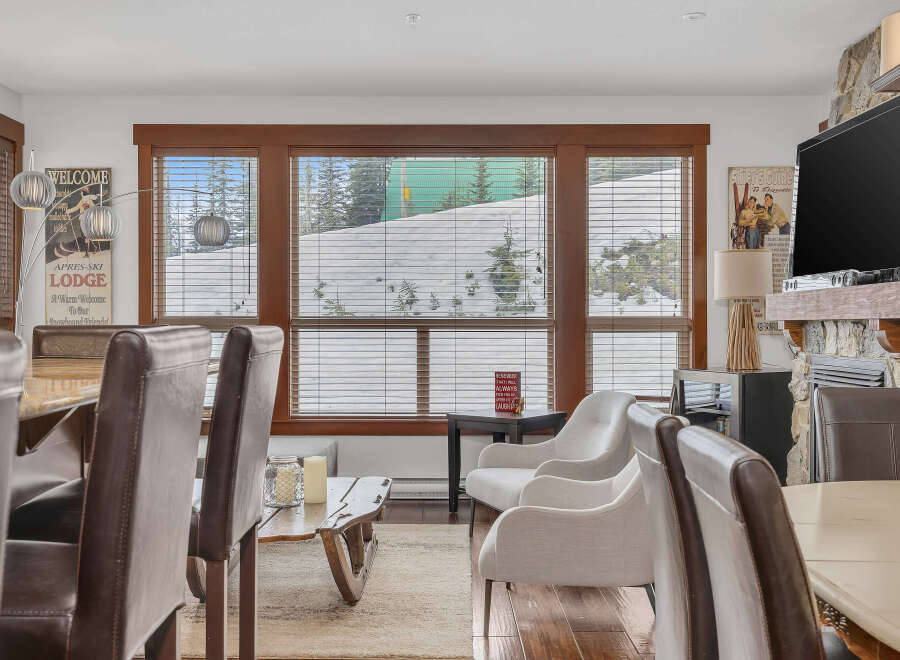 This stunning living space features a cozy fireplace, perfect for those chilly evenings.
