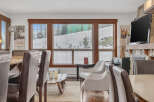 This stunning living space features a cozy fireplace, perfect for those chilly evenings.