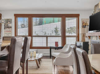 This stunning living space features a cozy fireplace, perfect for those chilly evenings.