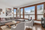 This cozy living room boasts a comfortable sectional sofa, perfect for relaxing after a day on the slopes.