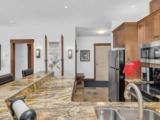 This stunning kitchen boasts a beautiful granite countertop, perfect for meal preparation and entertaining.