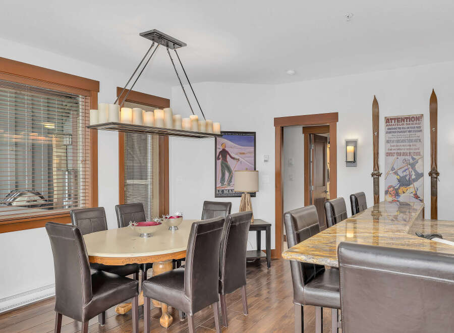 This stunning dining area boasts a blend of rustic charm and modern elegance.